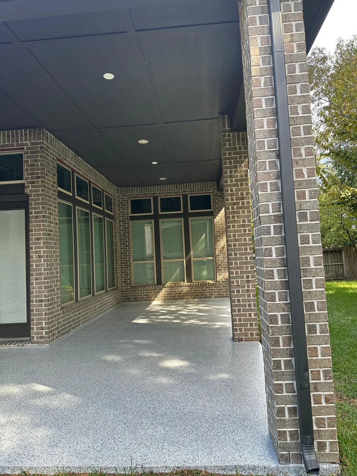 Covered patio with a polyaspartic top coat over epoxy flake