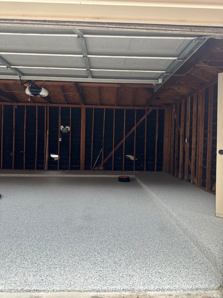 Finished epoxy flake garage floor with polyaspartic top coat