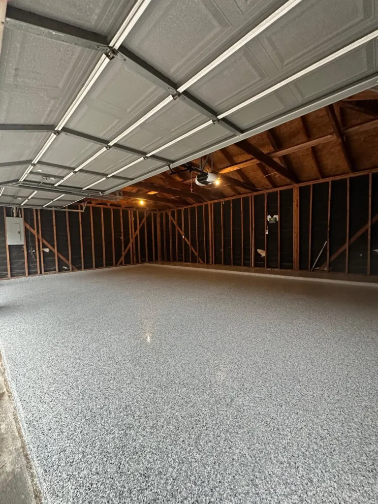 Finished epoxy flake garage floor with a glossy polyaspartic top coat
