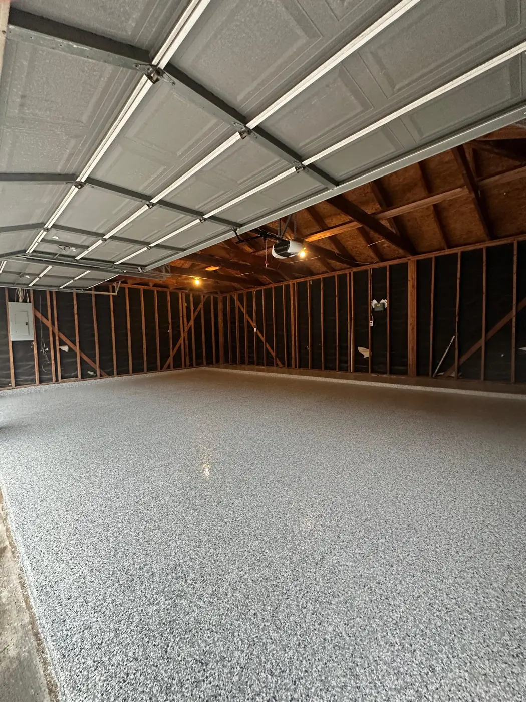 Finished epoxy flake garage floor with polyaspartic top coat