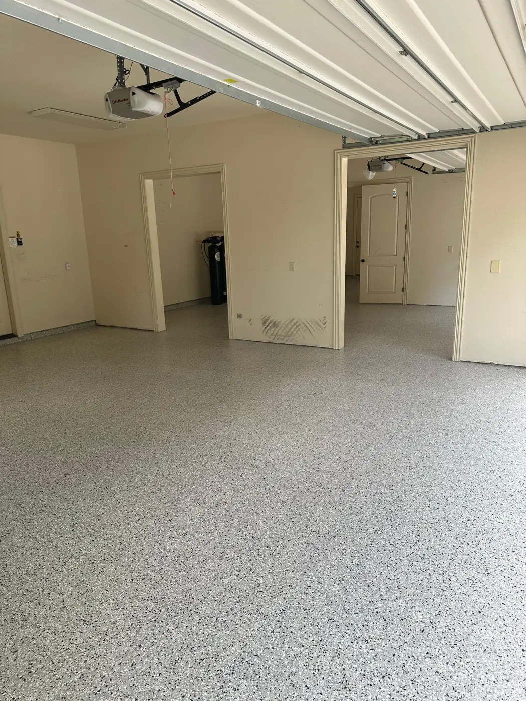 Epoxy flake garage floor sealed with a polyaspartic top coat