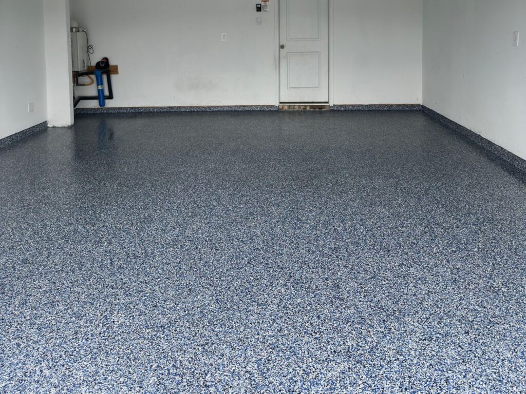 Finished Orbit Flake System epoxy floor in a two-car garage