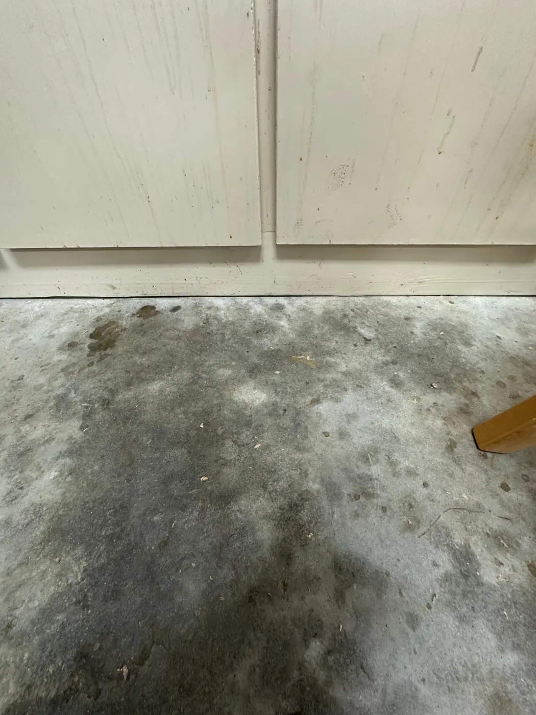 Oil-stained garage floor before epoxy
